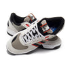 A pair of ADIDAS TEKKIRA CUP sneakers in Orbit Grey, Core Black, and Solar Red with white laces and mesh panels overlap on a white background, showcasing their classic cupsole design—ideal for skateboarding.