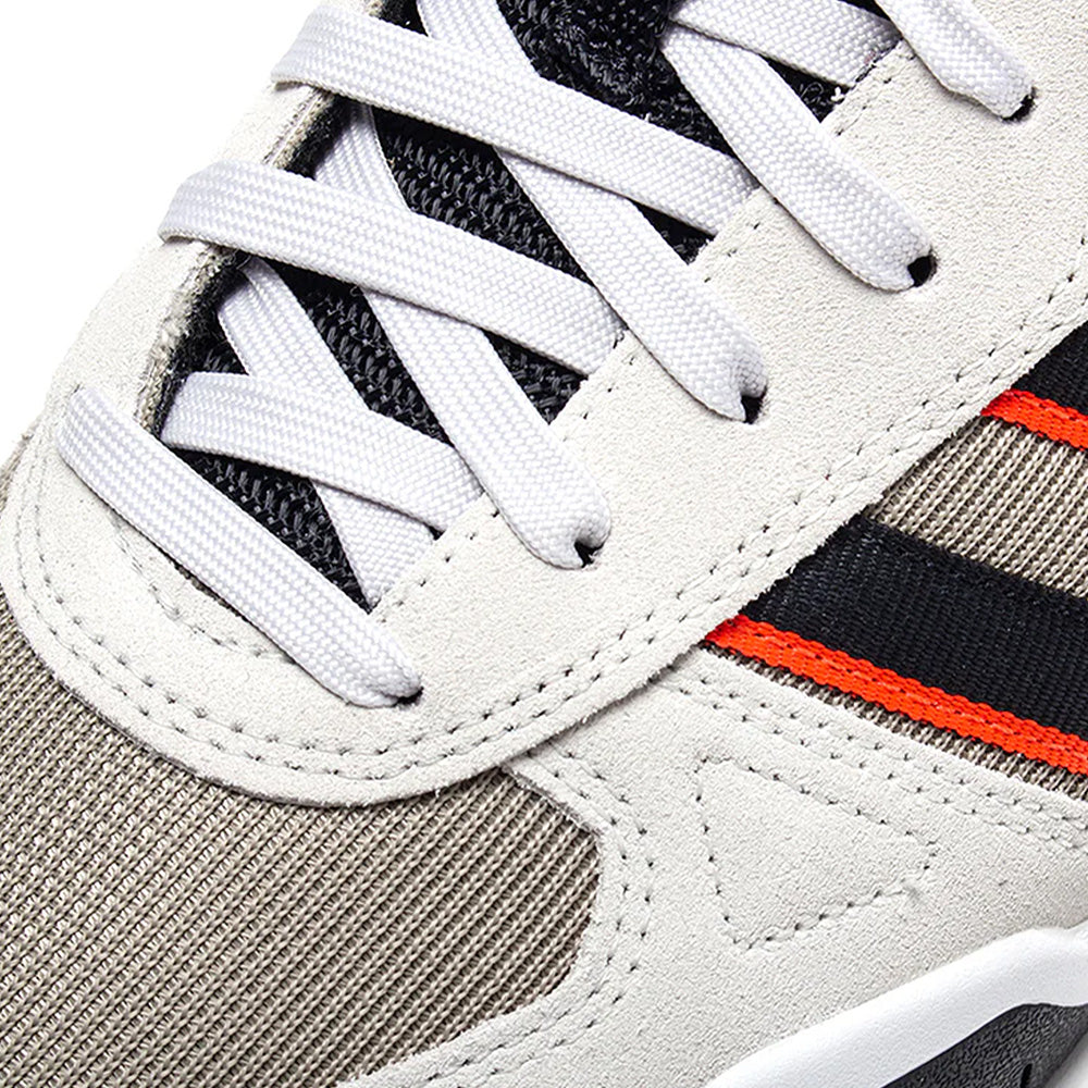 Close-up of the ADIDAS TEKKIRA CUP in Orbit Grey/Core Black/Solar Red, featuring white laces, grey suede overlays, black mesh, and black with solar red stripe details on the side atop a durable cupsole.