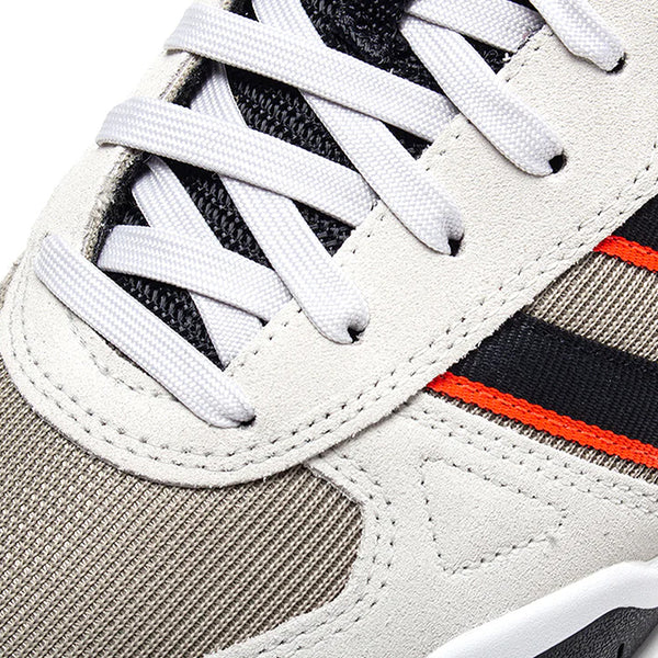 Close-up of the ADIDAS TEKKIRA CUP in Orbit Grey/Core Black/Solar Red, featuring white laces, grey suede overlays, black mesh, and black with solar red stripe details on the side atop a durable cupsole.