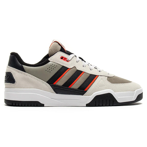 The ADIDAS TEKKIRA CUP in Orbit Grey, Core Black & Solar Red is a low-top cupsole sneaker featuring a beige upper with black accents and red stripes—ideal for everyday wear or as skateboard-inspired footwear.