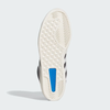 The image displays the sole of the ADIDAS SUPERSKATE ADV CORE BLACK / CRYSTAL WHITE / OFF WHITE, featuring a hexagonal tread pattern, blue rectangular insert, and curved grooves at the toe and heel.