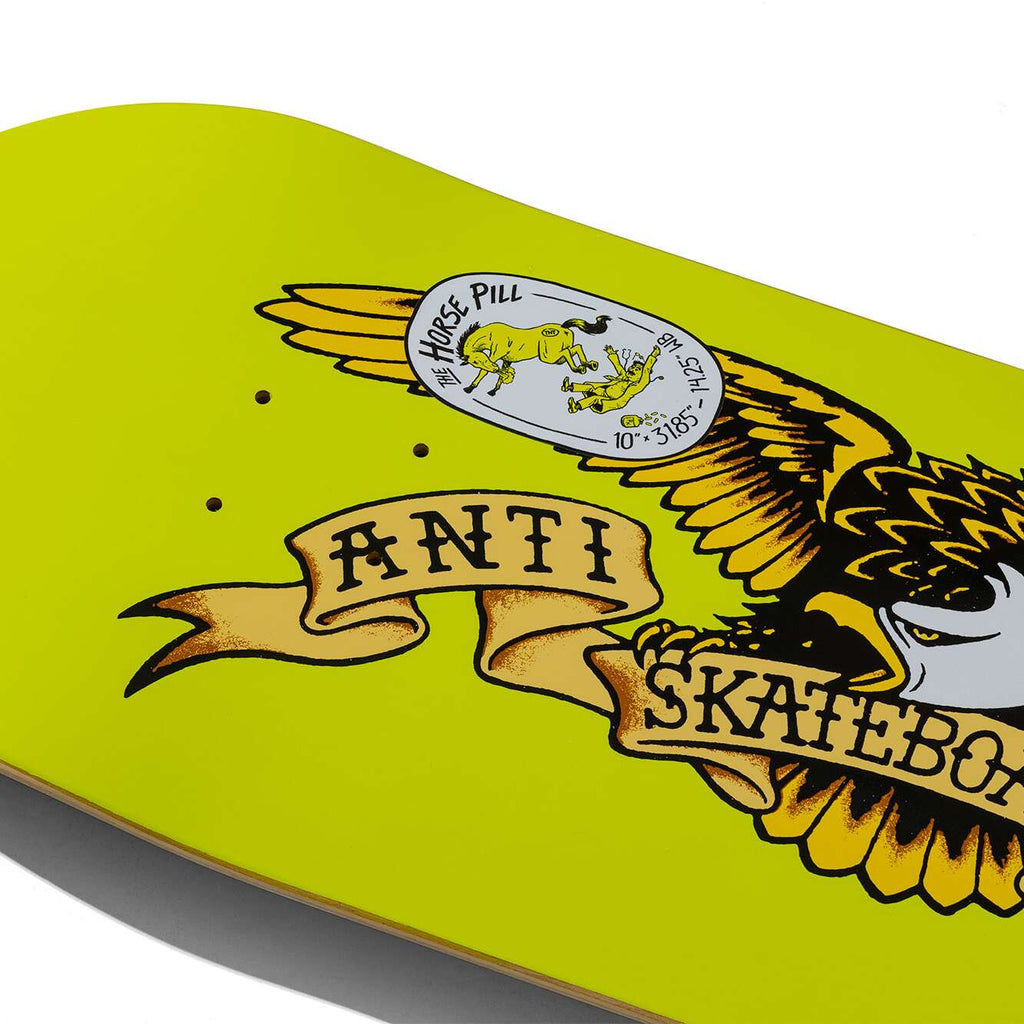 The ANTIHERO CLASSIC EAGLE HORSE PILL skateboard deck, measuring 8.75" in width and displaying a striking yellow color, showcases an eagle with a ribbon reading "Anti Skateboard" alongside a graphic of a horse pill labeled "Horse Pill." This deck from ANTIHERO is perfect for skaters who appreciate bold graphics paired with exceptional design.