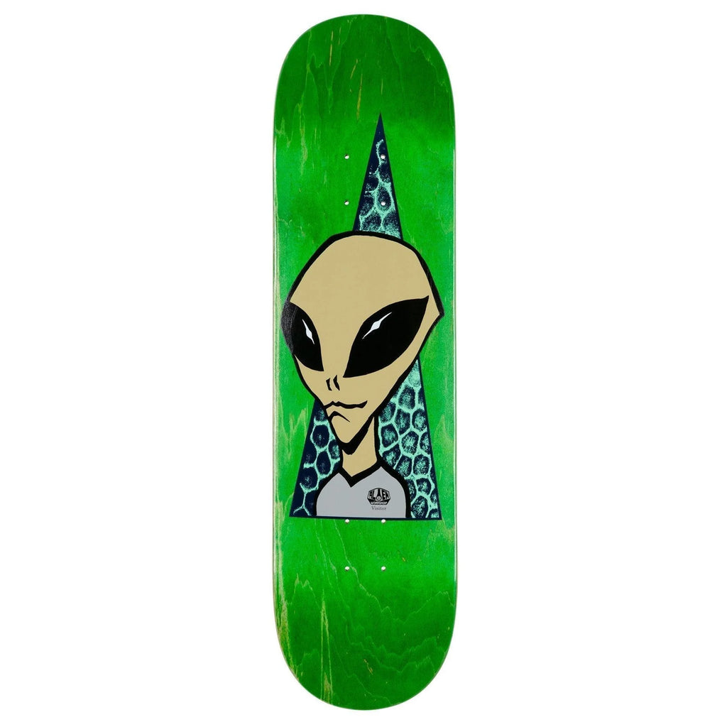 A green skateboard with an ALIEN WORKSHOP VISITOR on it.
