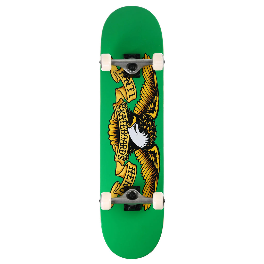 A green skateboard deck with a picture of an eagle on it, complete with trucks and wheels.