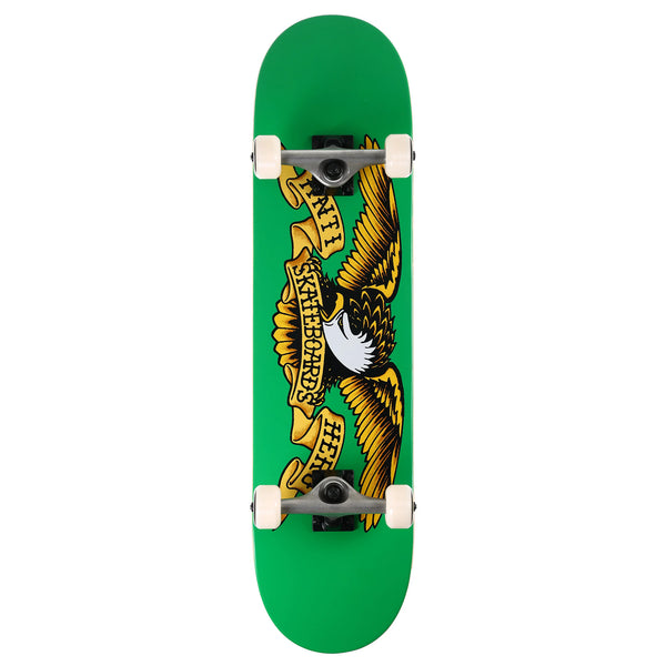 A green skateboard deck with a picture of an eagle on it, complete with trucks and wheels.
