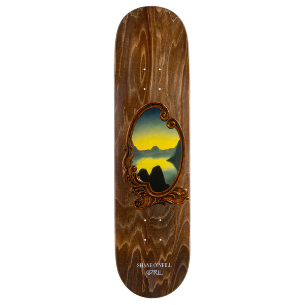 An APRIL skateboard deck with an image of a lake on it.
