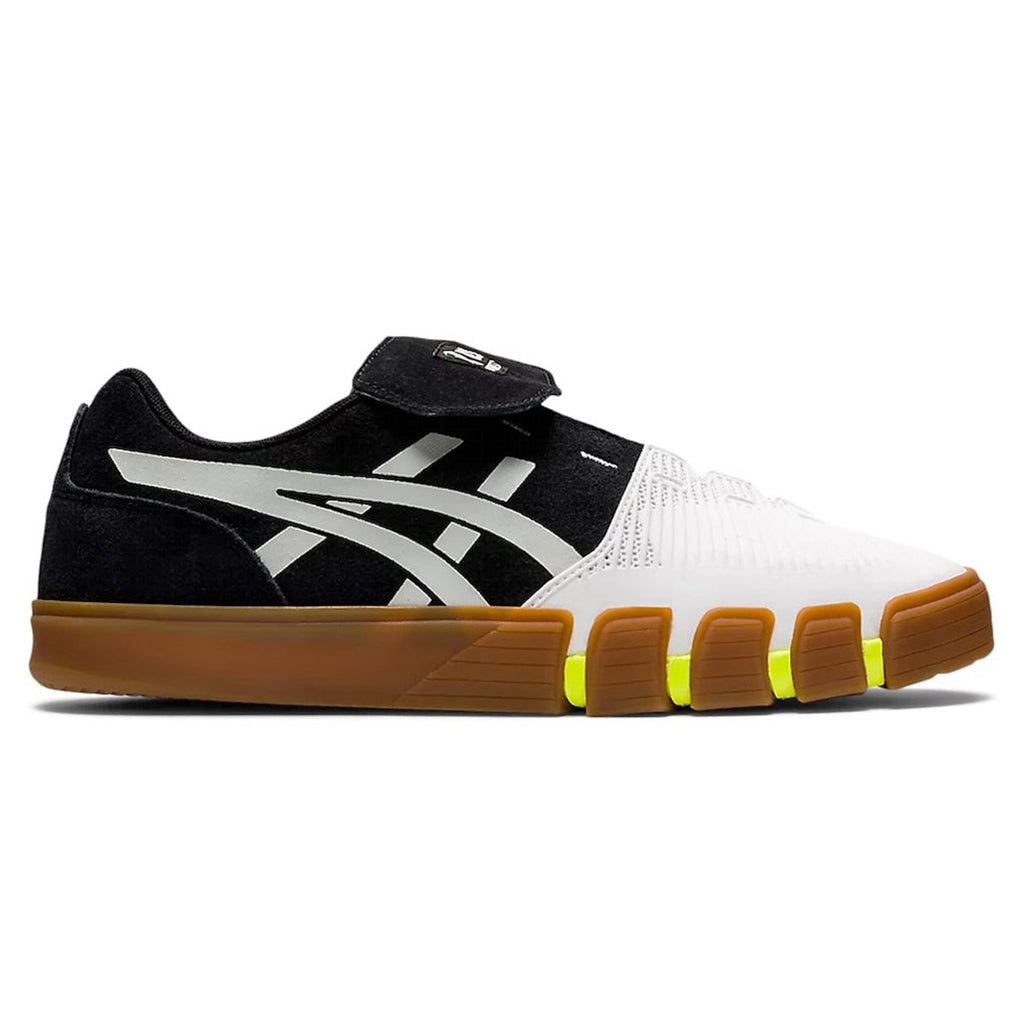 A black and white ASICS GEL-FLEXKEE PRO BLACK / POLAR SHADE shoe with yellow soles.