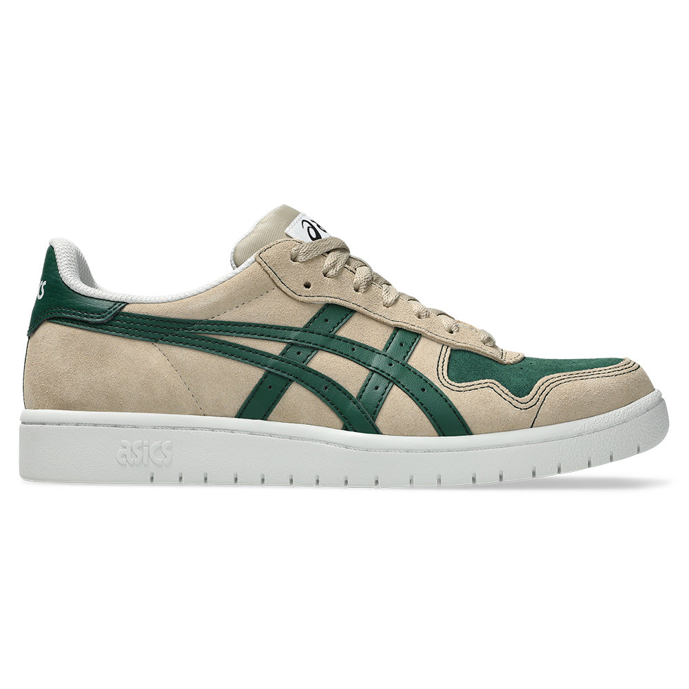 The ASICS JAPAN PRO WOOD CREPE / EVERGREEN features a beige suede upper with green side stripes, a white sole, reflective accents, and ASICS branding on the tongue and heel.