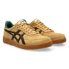 These ASICS JAPAN PRO WOOD THRUSH / BLACK COFFEE skateboarding shoes combine a stylish tan and black exterior with a green interior lining. They feature a gum sole and lace-up design, while the durable suede construction enhances their toughness, making them ideal for skaters who push their limits.