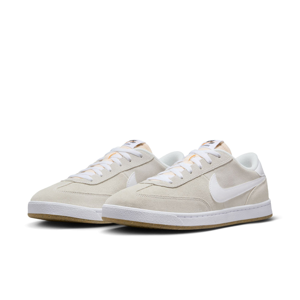 Introducing the NIKE SB FC CLASSIC in Summit White, these light gray and white sneakers boast white laces, a prominent swoosh logo, and durable white rubber soles. Ideal for skateboard enthusiasts who value both style and functionality.