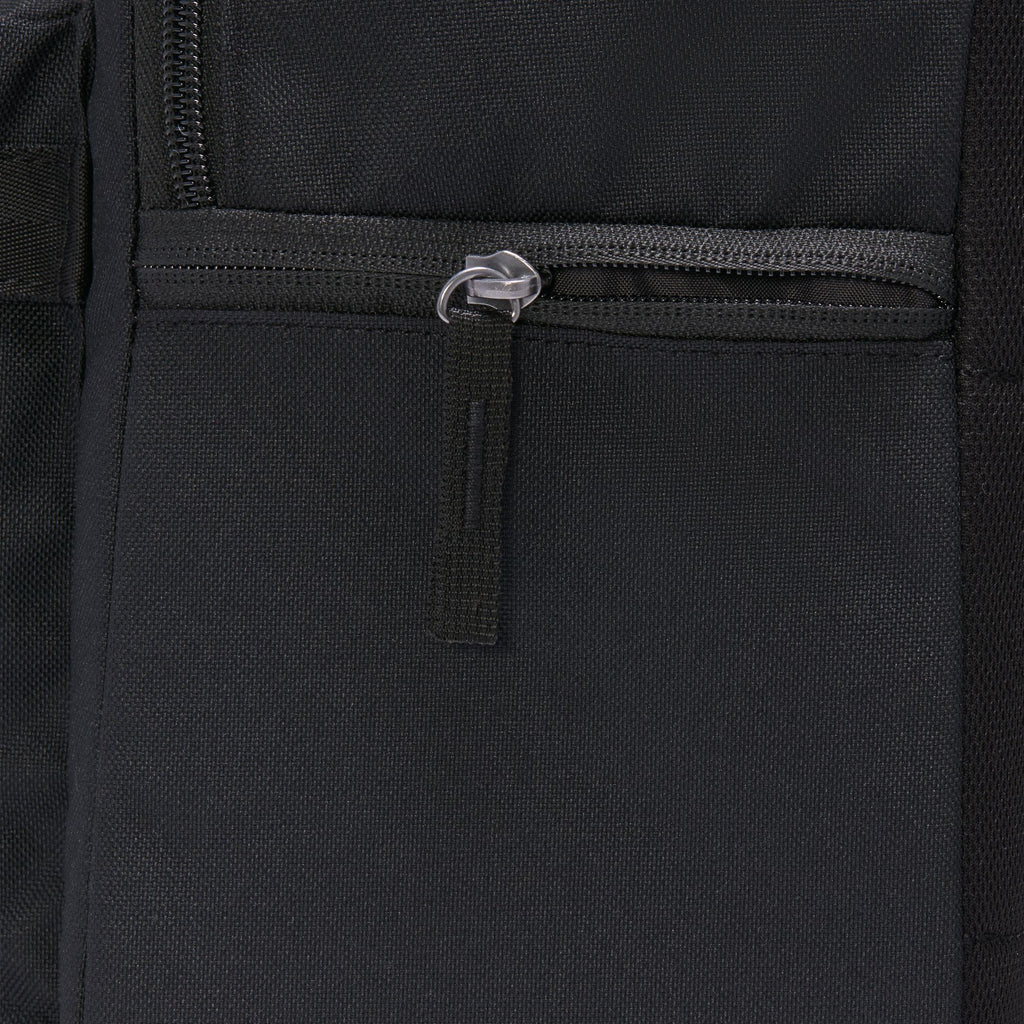 Close-up of the black Nike Heritage Backpack highlights a zippered compartment with a metal pull, made from water-resistant material.