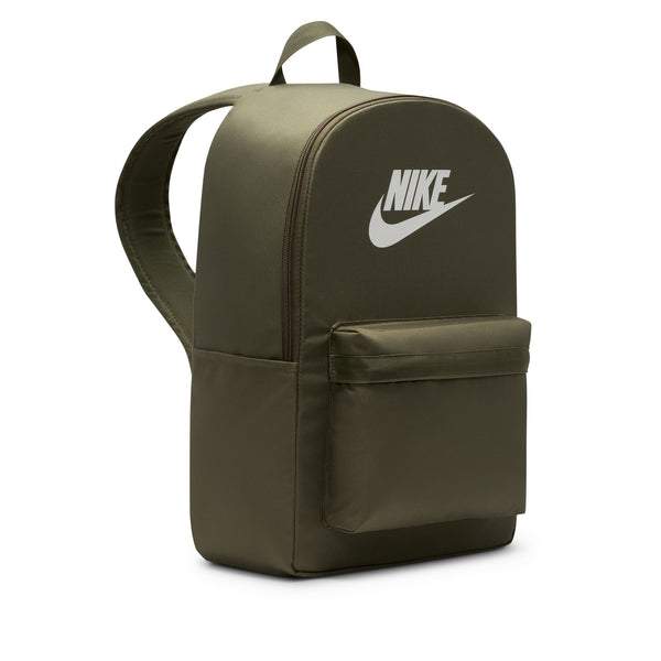 The NIKE HERITAGE BACKPACK MEDIUM OLIVE by nike is made from recycled polyester, features a green design with a front zip pocket, white Nike logo on the top front, and an interior laptop sleeve, pictured on a plain white background.