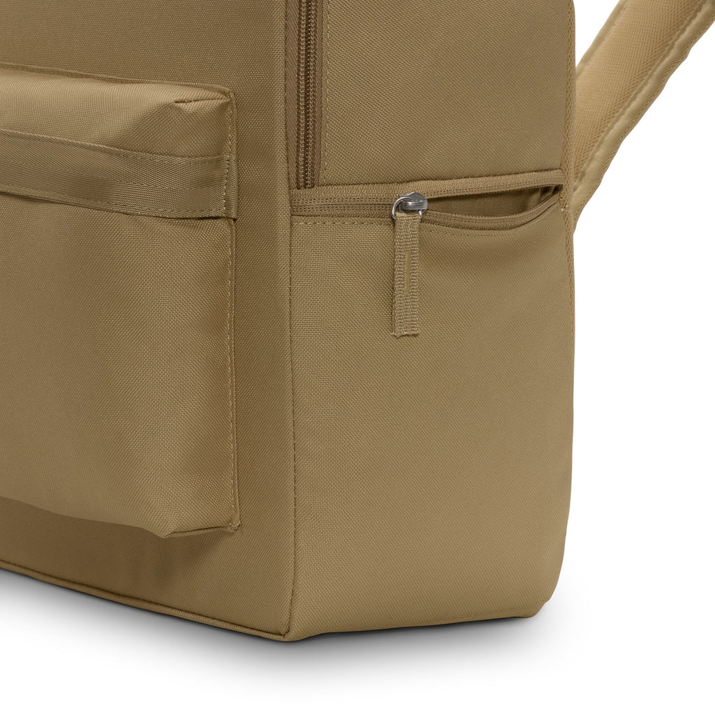 Close-up of the Nike Heritage Backpack in Parachute Beige/Summit White, highlighting a zippered front pocket made from recycled polyester.