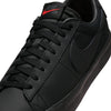 Close-up of the NIKE SB BLAZER LOW PRO GT in an all-black design, featuring a red Nike logo on the tongue, ideal for skateboarding in Columbia SC.