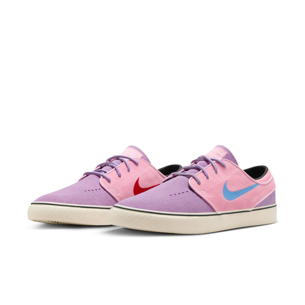 A pair of the purple and pink janoski shoes with purple laces and red and blue checks on the side.
