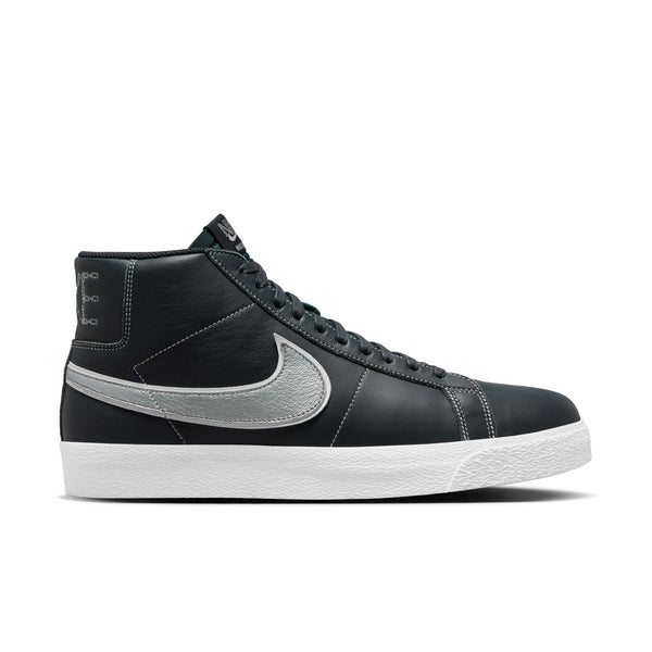 A pair of Nike SB Blazer Mid x Mason Silva Blacked Blue / Wolf Grey sneakers on a white background.