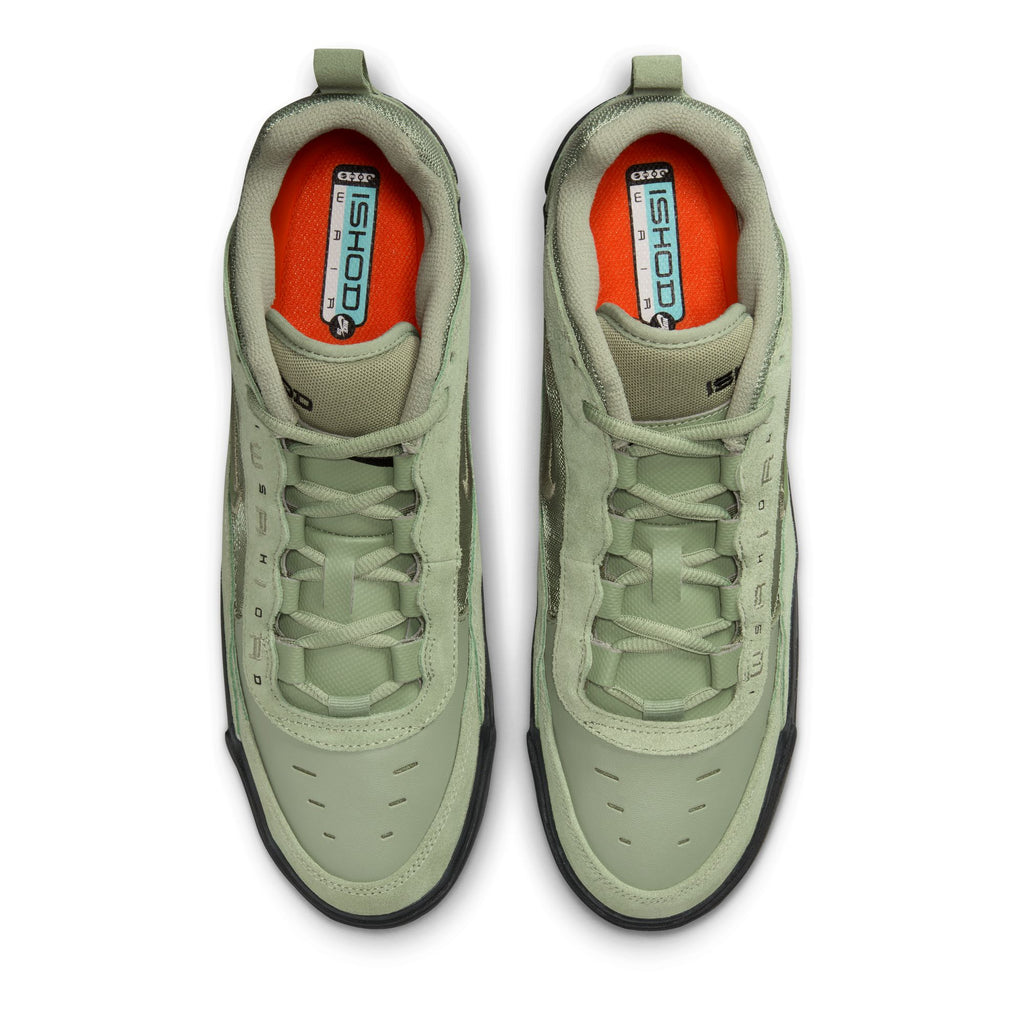 Top-down view of a pair of light green athletic sneakers with black soles, orange insoles, and the label "ISHOD" visible on the tongue. These nike NIKE SB ISHOD 2 AIR MAX OIL GREEN/OIL GREEN sneakers are designed to skate hard with their durable build and Max Air technology for ultimate comfort.