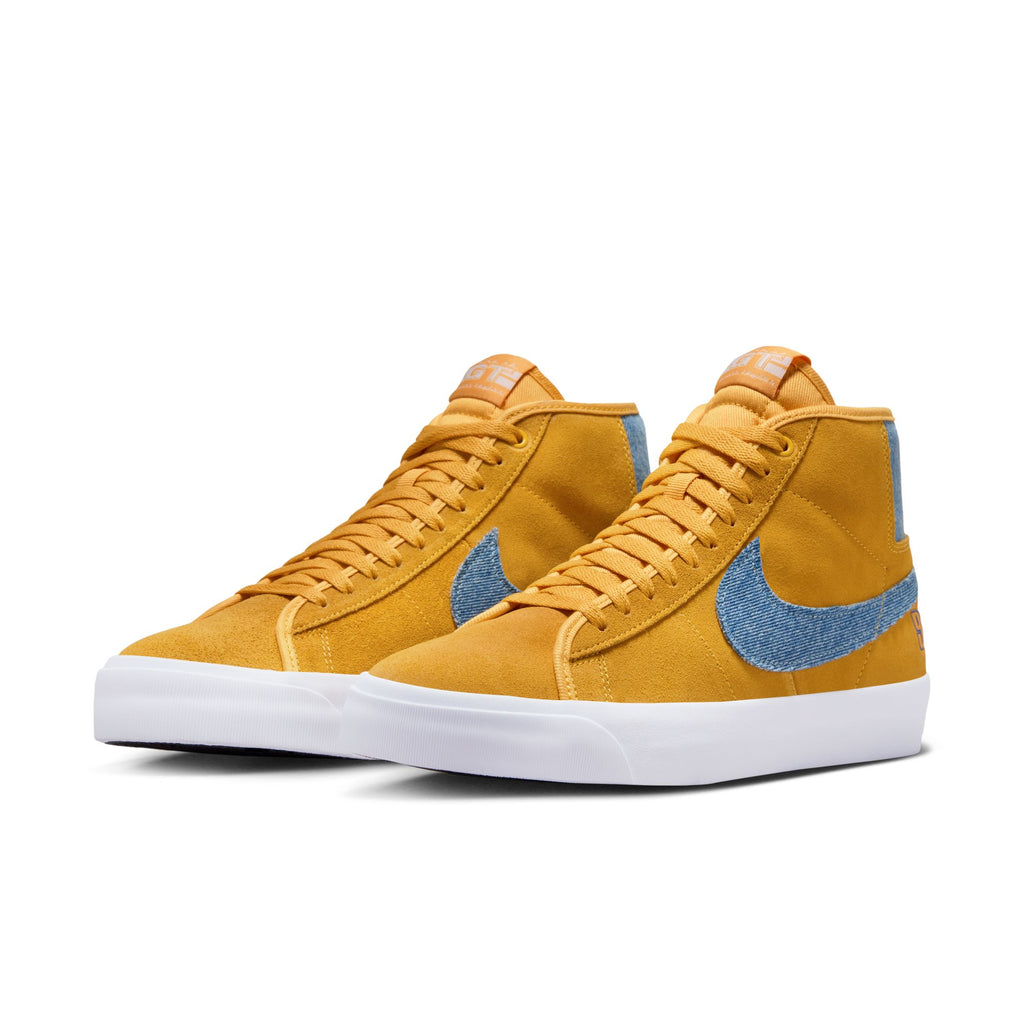 The NIKE SB BLAZER MID PRO GT UNIVERSITY GOLD / GAME ROYAL, endorsed by Grant Taylor, features a vibrant yellow and blue colorway.