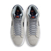 Top view of the NIKE SB BLAZER MID WOLF GREY / MIDNIGHT NAVY sneakers by Nike, featuring high-top gray design with gray laces and navy blue interior accents. The tongue showcases a red Nike SB logo, perfect for skateboarders, and includes Zoom Air cushioning for added comfort.