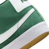 The NIKE SB BLAZER MID FIR / WHITE is a green and white skate shoe designed for skateboarders.