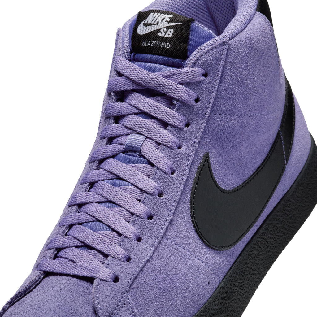 Close-up of a Nike SB Blazer Mid in Dusty Amethyst/Black-Dusty Amethyst, featuring a black swoosh and sole. Designed for skateboarders, it offers ultimate performance with Zoom Air cushioning for enhanced comfort and support.