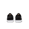 A pair of black and white nike SB ZOOM JANOSKI OG+ BLACK / WHITE-BLACK sneakers on a white surface.