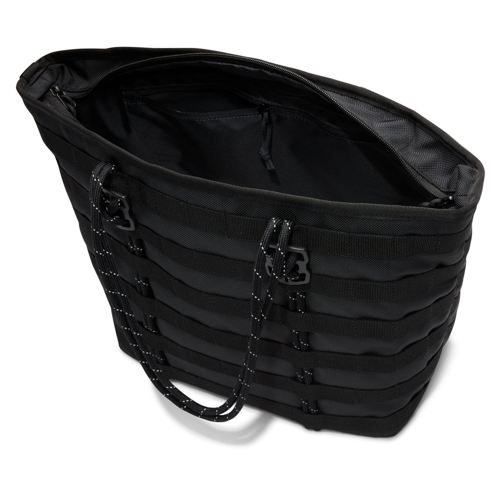 The NIKE RPM TOTE (26L) BLACK is a stylish recycled polyester tote with horizontal webbing, zippered top opening, and rope handles—ideal as a sleek everyday laptop bag.