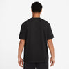 The back view of a man wearing a black NIKE SB 'SPORTS GUY' SKATE TEE BLACK.