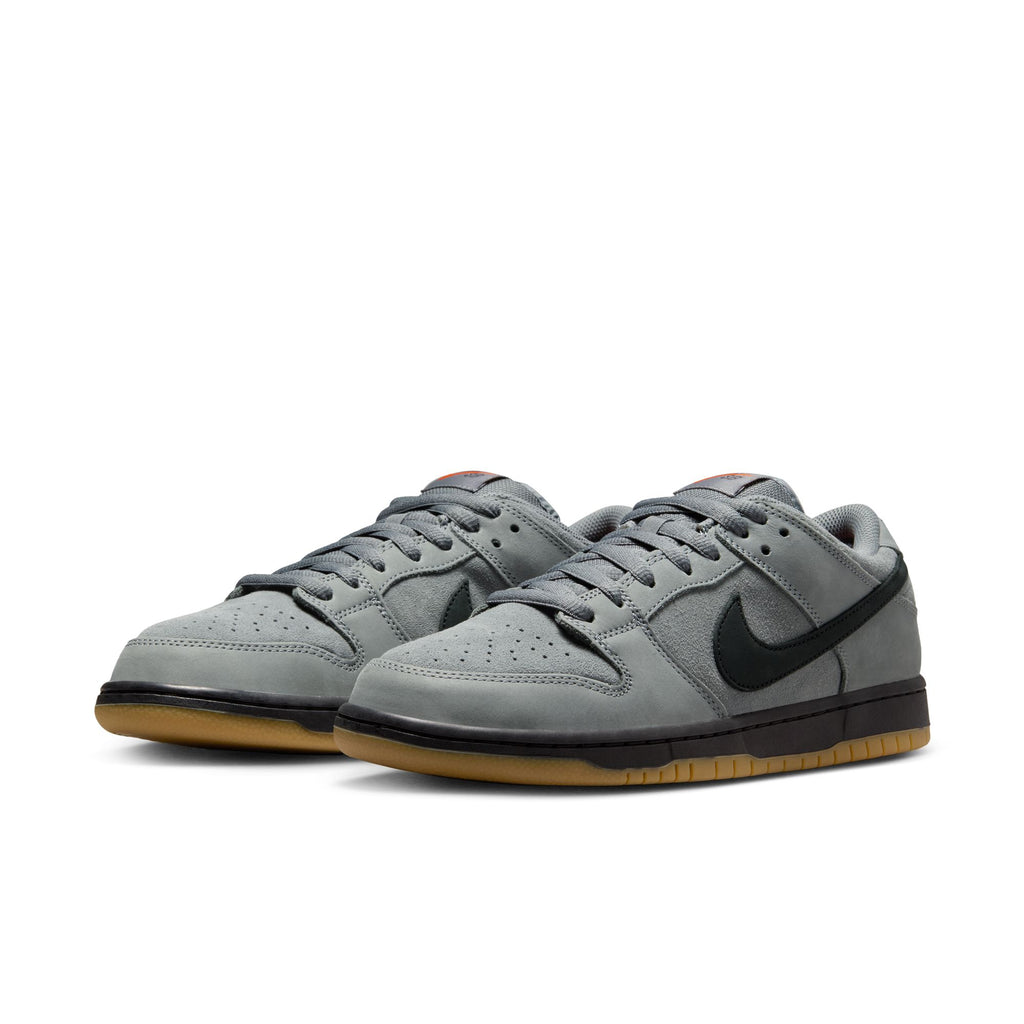 A pair of NIKE SB DUNK LOW PRO in Cool Grey/Black-Cool Grey-Dark Grey with black swooshes, gray laces, and gum outsoles are displayed side by side on a white background.