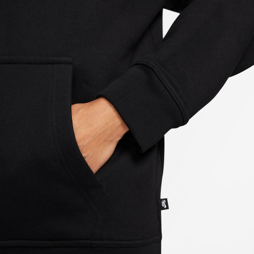 The back of a man wearing a nike SB Yuto Fleece Hoodie Black.