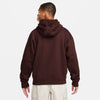 The back view of a man wearing a maroon nike 'City of Love' fleece hoodie Earth/Brown.