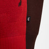 A close up of a red and brown Nike SB 'City of Love' Knit Sweater.