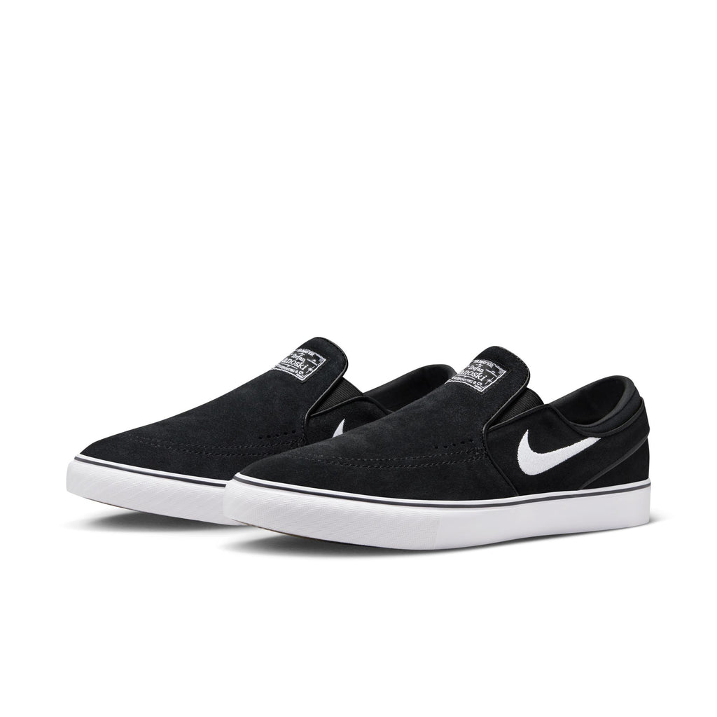 The NIKE SB Janoski+ Slip in black/white-black-black merges classic basketball DNA with sleek style, featuring durable white cupsoles and a signature white swoosh logo.