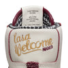A white and maroon nike SB x WELCOME MADRID Blazer Mid sneaker with the word 'lasa welcome' embroidered on it.