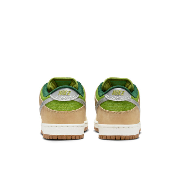 Rear view of a pair of NIKE SB DUNK LOW PRO WC "ESCARGOT" SESAME / METALLIC SILVER-PEAR sneakers by Nike, showcasing a green, tan, and silver color scheme. The shoes boast a green inner lining, a white midsole, and Air Zoom cushioning for added comfort.