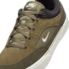 A close-up image of a NIKE SB MALOR sneaker in medium olive, sail-cargo khaki, and black with white logo detailing and a white sole. The shoe, perfect for skateboarders, features suede material and a lace-up design.