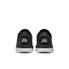 Back view of NIKE SB PS8 BLACK / WHITE sneakers featuring Flyknit construction and white soles, against a plain backdrop.