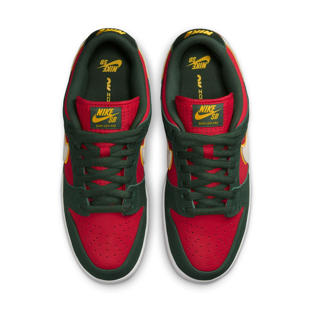 Top view of a pair of Nike SB 💫💚 sneakers in red and green with yellow accents and logos, crafted from premium materials.