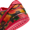 Close-up of the colorful NIKE SB DUNK LOW 🧙‍♂️ by Nike, featuring a red sole and trim. The side displays a camouflage pattern with "No Place Like Home." A plush suede upper enhances its vibrant design, while the foam midsole provides ultimate comfort and support.