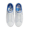 Top view of the NIKE SB BLAZER LOW PRO GT "20 YEARS" SUMMIT WHITE/GAME ROYAL sneakers showcases their intricate design, with blue accents and detailed insoles featuring floral and tiger motifs. Inspired by Grant Taylor's Blazer Low Pro GT, these shoes are equipped with Air Zoom cushioning for exceptional comfort.