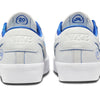 Back view of the NIKE SB BLAZER LOW PRO GT "20 YEARS" sneakers in Summit White and Game Royal, showcasing "20 Years" and the Nike logo on the heel tabs, complemented by Grant Taylor's signature style and Air Zoom cushioning for enhanced comfort.