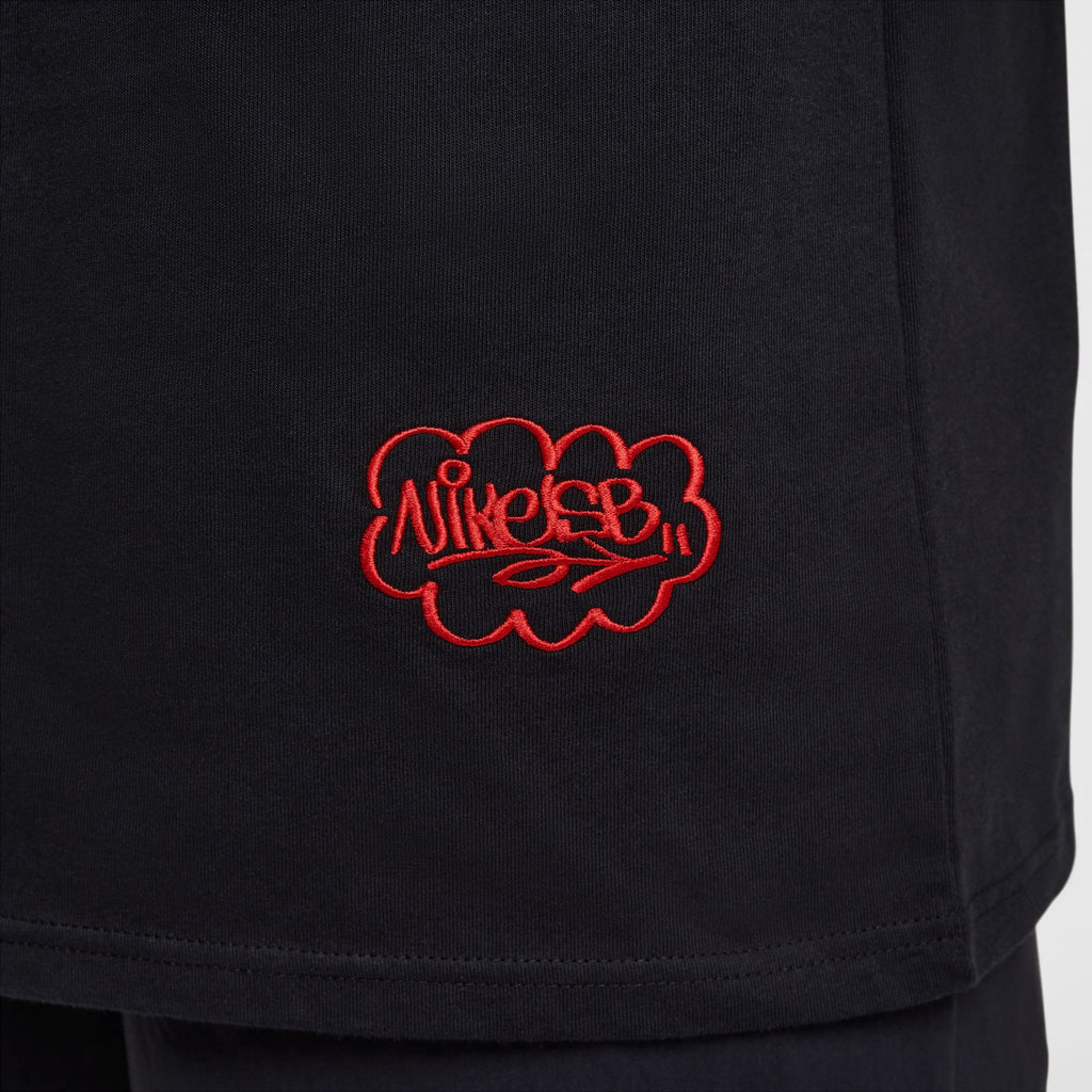 The NIKE SB MAX90 Spray Can Skate Tee in black features red graffiti-style "Nike SB" embroidery inside a cloud shape, embodying skate culture.