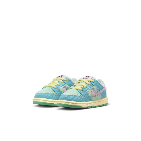 A pair of vibrant NIKE SB DUNK LOW PRO VERDY TD sneakers in Blue Gaze, Arctic Pink, and Bicycle Yellow, showcasing the prominent Nike logo on the sides, displayed against a white background.