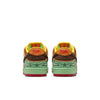 A pair of NIKE SB RODEO DUNK LOW TOURMALINE/BAROQUE BROWN-MONARCH sneakers by Nike, seen from the back, showcasing green soles, brown and yellow uppers, and red accents.