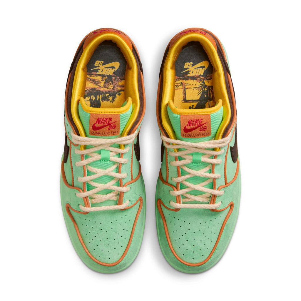 Top view of nike NIKE SB RODEO DUNK LOW sneakers in tourmaline, baroque brown, and monarch with yellow lining and graphic insoles—ideal for skateboarding or those pursuing Skateboarding Scholarships.