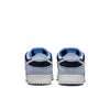 Rear view of NIKE SB DUNK LOW PRO ALUMINUM sneakers in blue, black, and white. These shoes have visible "NIKE" branding on the heel, premium materials, and a light outsole for durable traction.