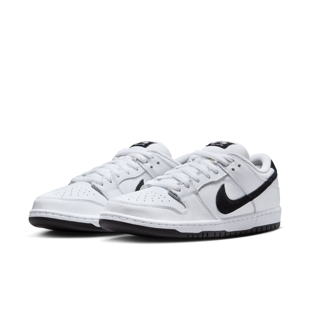 The NIKE SB DUNK LOW PRO WHITE/BLACK-WHITE-BLACK sneakers feature a black swoosh logo, sleek suede upper, and durable rubber outsole.