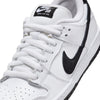 Close-up of the NIKE SB DUNK LOW PRO WHITE/BLACK-WHITE-BLACK sneaker from Nike, showcasing a suede upper, black swoosh, black sole, and finished with white laces and tongue with a black label.