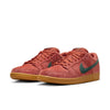 A pair of nike NIKE SB DUNK LOW PRO BURNT SUNRISE / VINTAGE GREEN with green swooshes, gum soles, and a comfortable foam midsole.