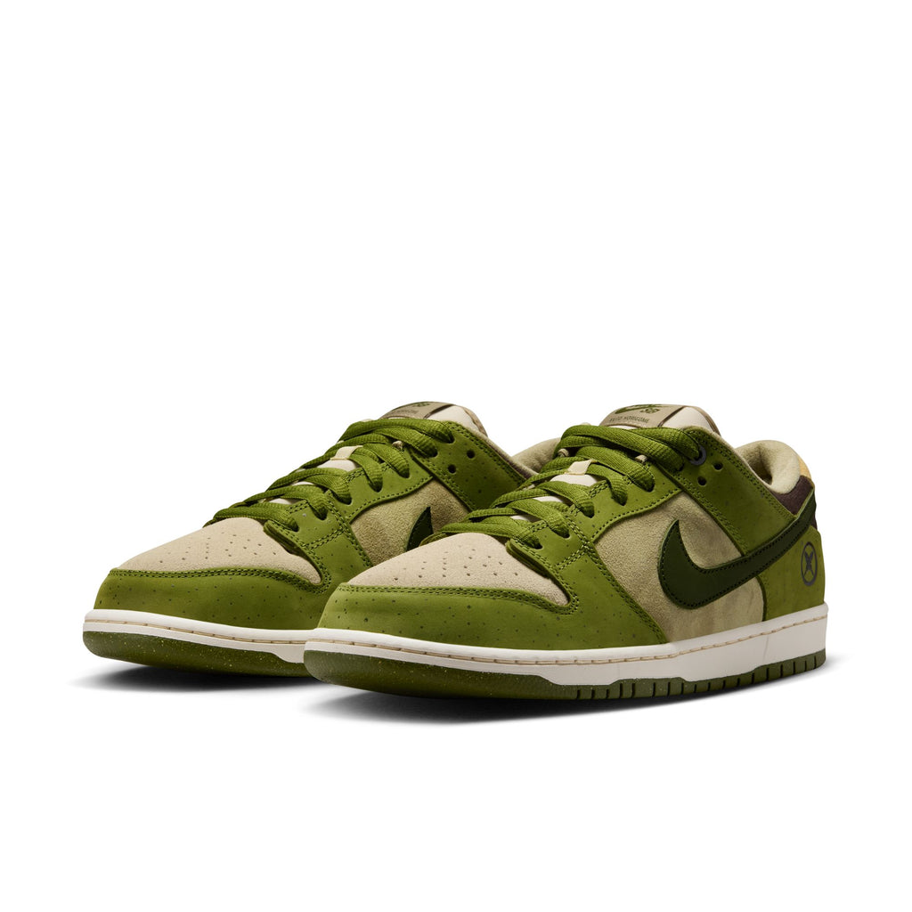 The RAFFLE WINNER NIKE SB YUTO "MATCHA" DUNK LOW PRO sneakers feature a green and beige design with the iconic swoosh, premium materials, perforated toe boxes, white midsoles, and durable traction from green outsoles.